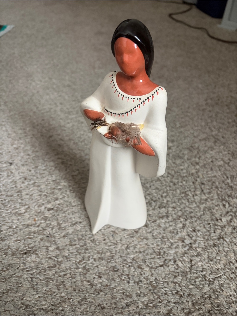 White Ceramic Figurine with Brown Accents